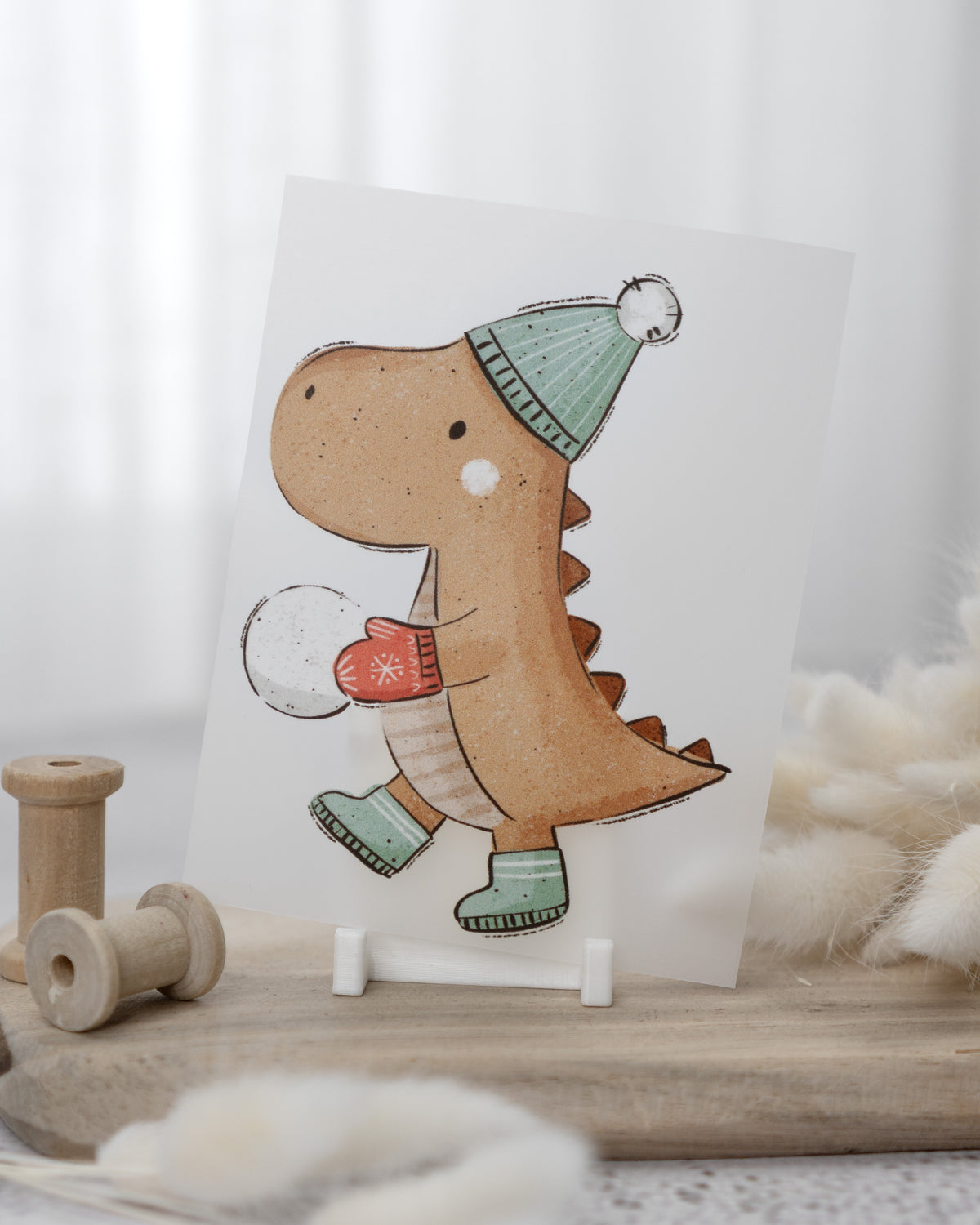 Dino mit Schneeball - Bügelbild